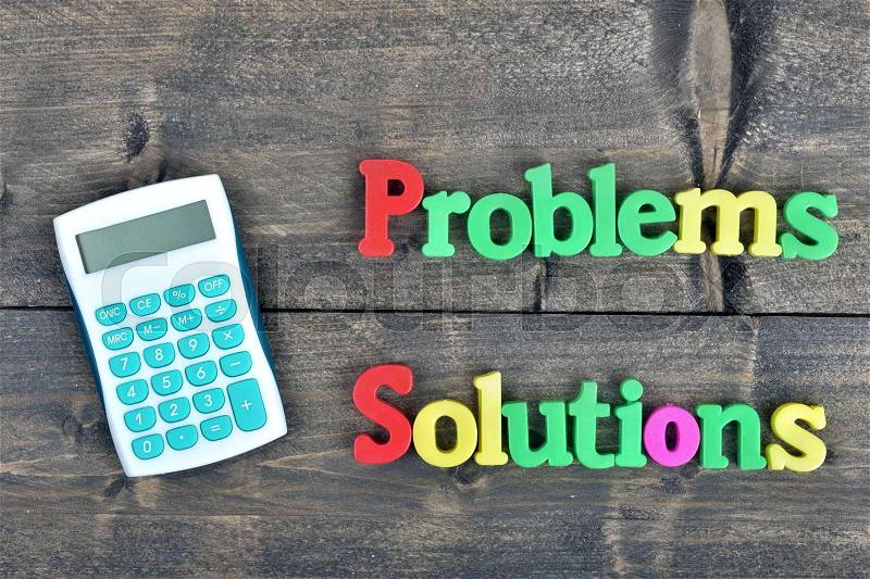 Problems and Solutions word on wooden table, stock photo