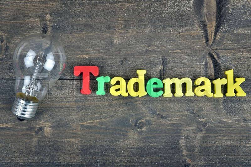 Trademark word on wooden table, stock photo