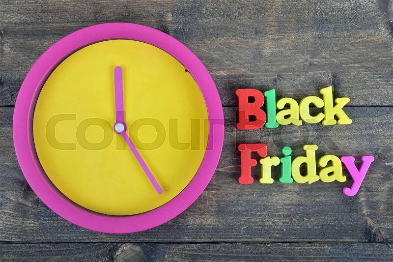 Black friday word on wooden table, stock photo
