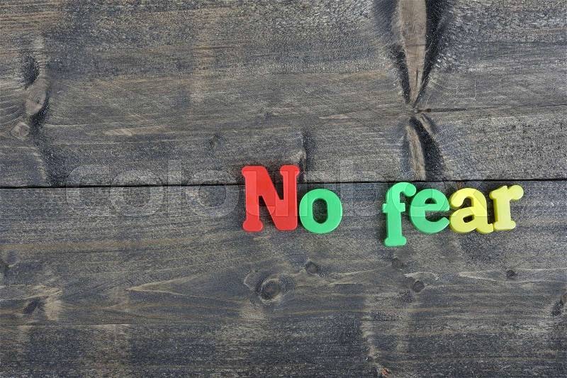 No fear word on wooden table, stock photo
