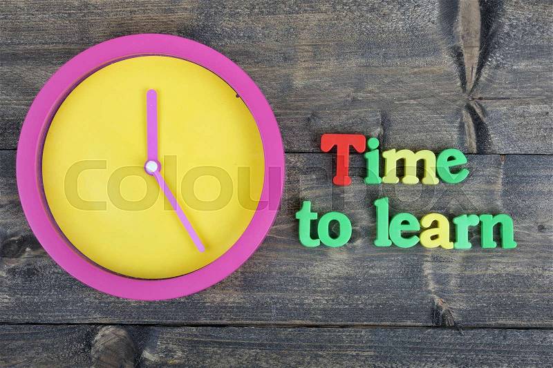 Time to learn word on wooden table, stock photo