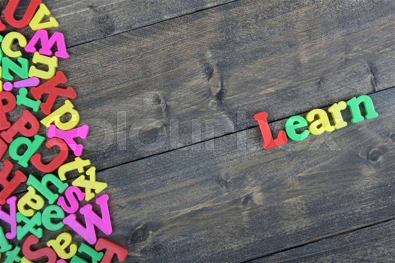 Learn word on wooden table, stock photo