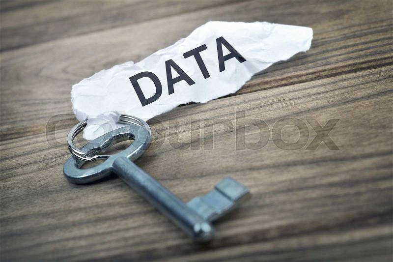 Key with message Data on wooden table, stock photo