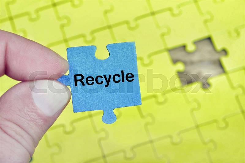 Puzzle pieces with word Recycle, stock photo