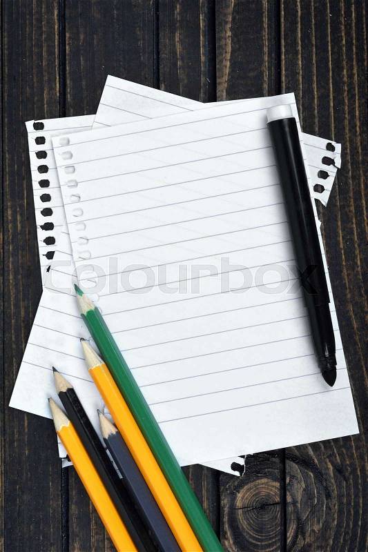 Empty paper and office tools on wooden table, stock photo