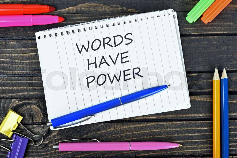 Words have power text on notepad and office tools on wooden table, stock photo