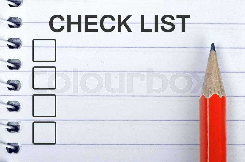 Check list on notepad and red pencil, stock photo