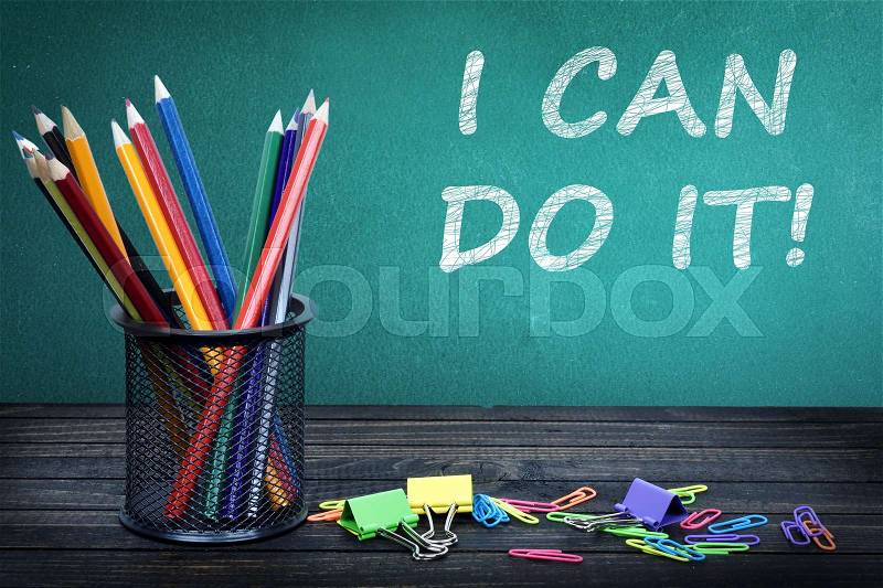 I can do it text on green board and group of pencils, stock photo