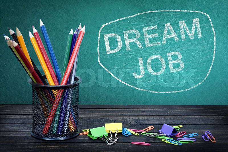 Dream Job text on green board and group of pencils, stock photo