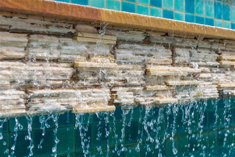 Water fall on brick with tile wall, stock photo