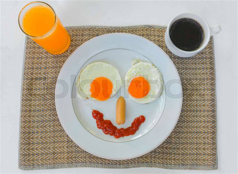 Happy Face Frying Eggs for breakfast isolate on white, stock photo