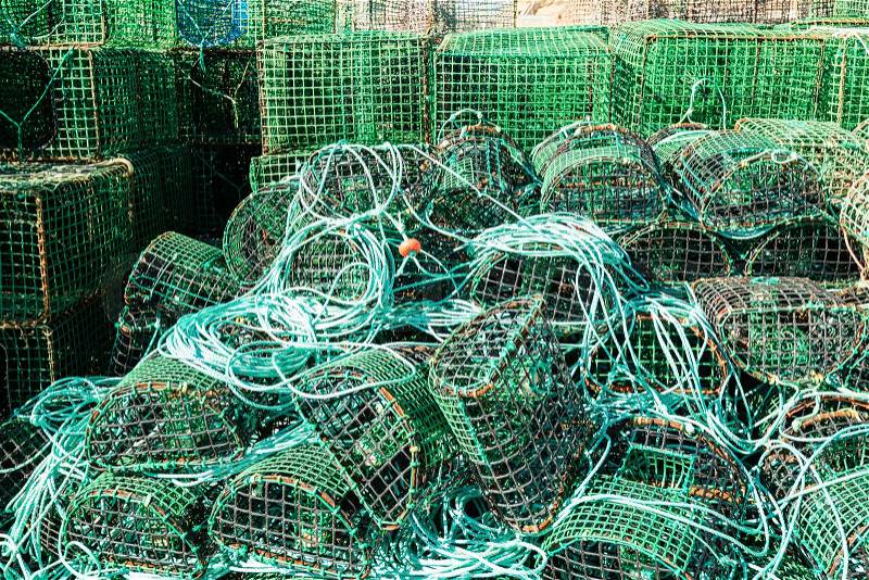 Green traps for catching octopus and fish in the sea, close-up, stock photo