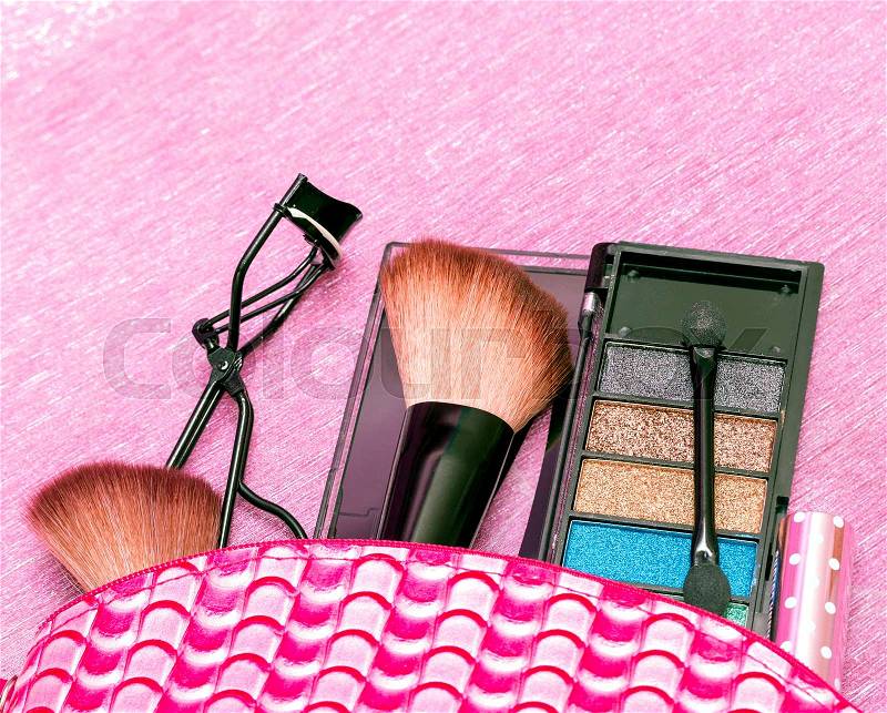 Makeup Brush Indicating Eyelash Curlers And Eyeshadow, stock photo