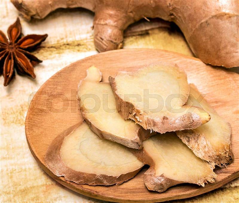 Sliced Ginger Root Shows Cinnamons Rhizome And Spices, stock photo