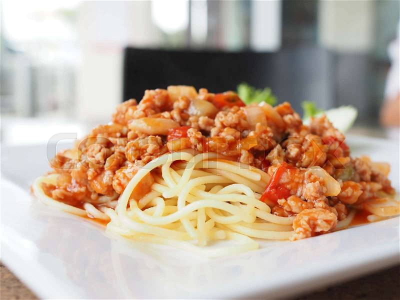 Delicious spaghetti bolognaise with a sauce of tomatoes and minced meat, stock photo