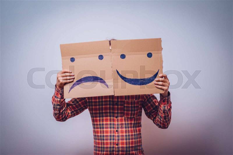 Conceptual image of a man changing his mood from bad to good, stock photo