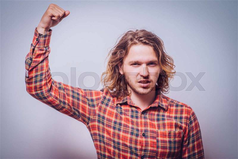 Man showing her muscles, stock photo