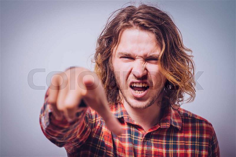 Angry man screaming, stock photo