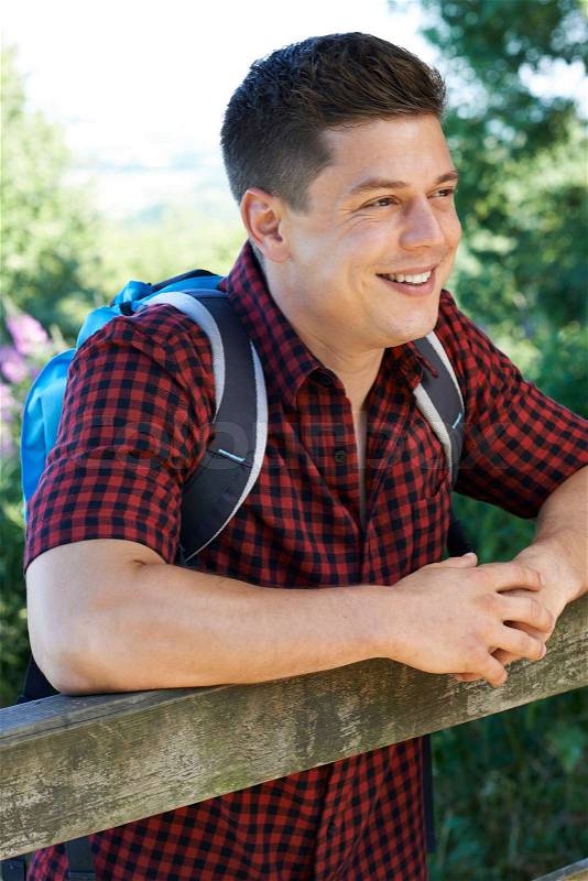 Young Man Hiking In Countryside, stock photo