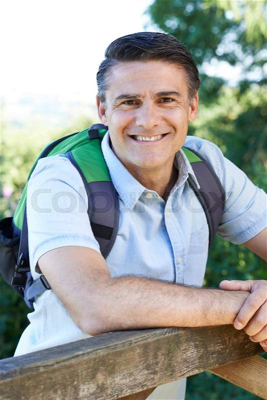 Portrait Of Mature Man Hiking In Countryside, stock photo