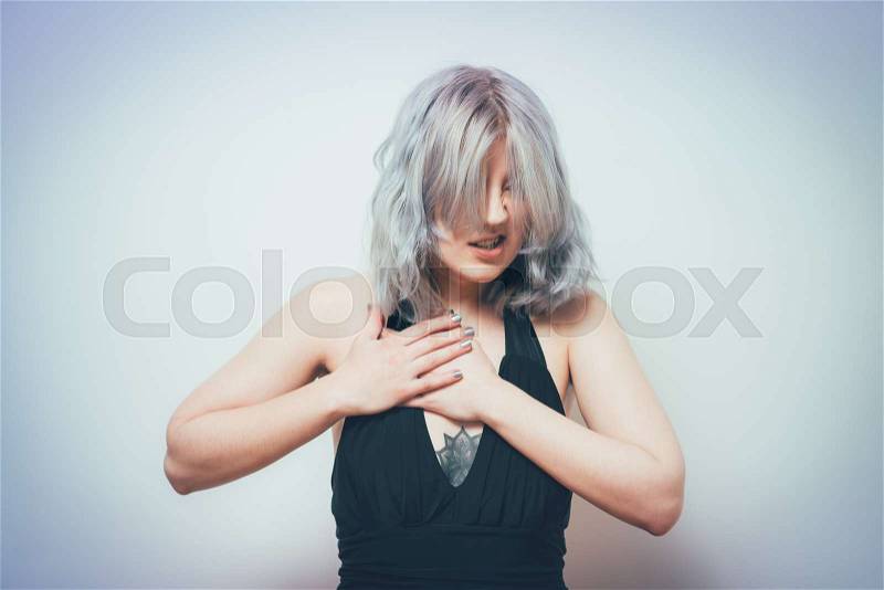 A woman with a heart attack, stock photo