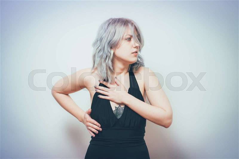 A woman with a heart attack, stock photo