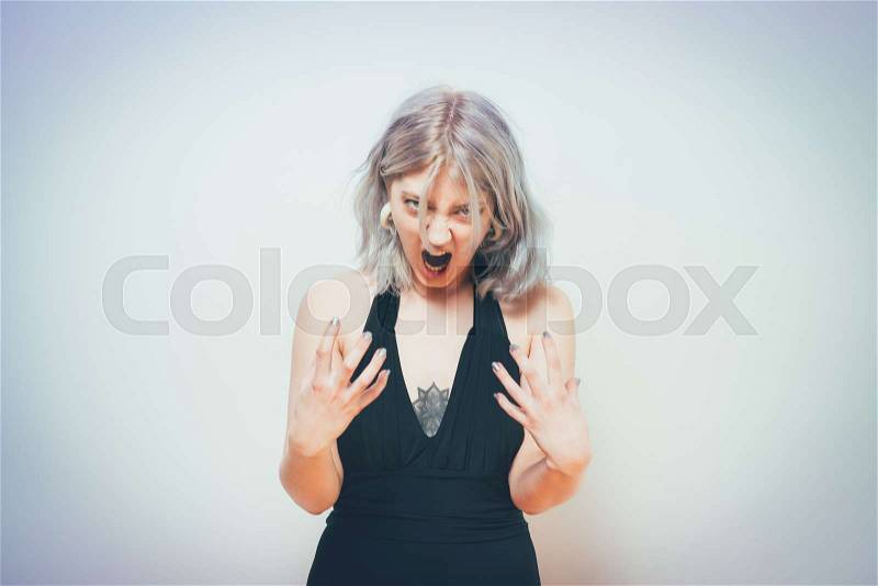 Angry screaming woman, stock photo