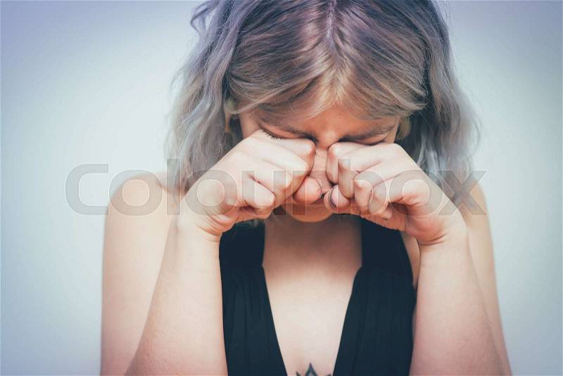 Woman crying, stock photo