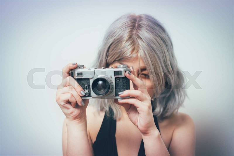 Woman with camera, stock photo