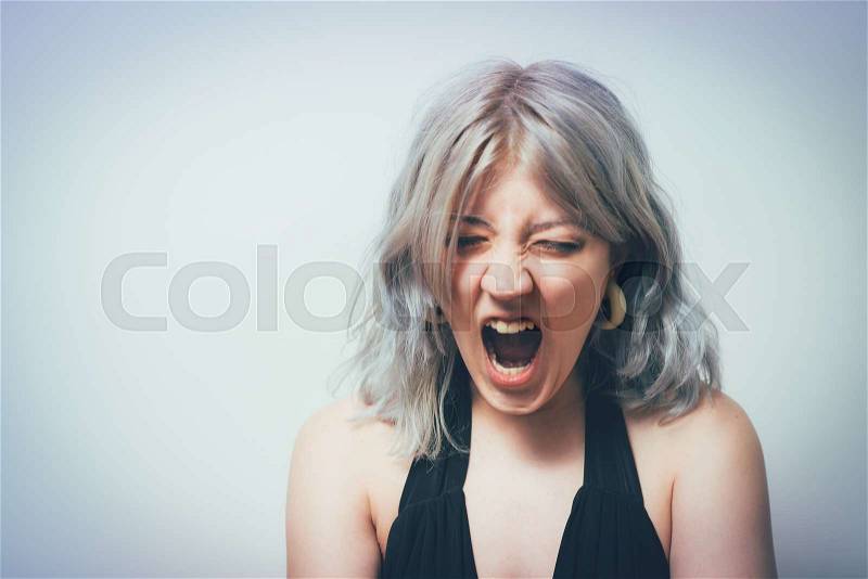 Angry screaming woman, stock photo