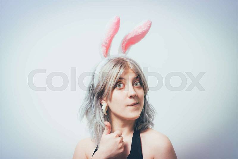 Portrait of girl with white rabbit ears, stock photo