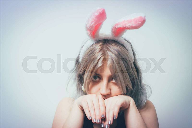 Portrait of girl with white rabbit ears, stock photo