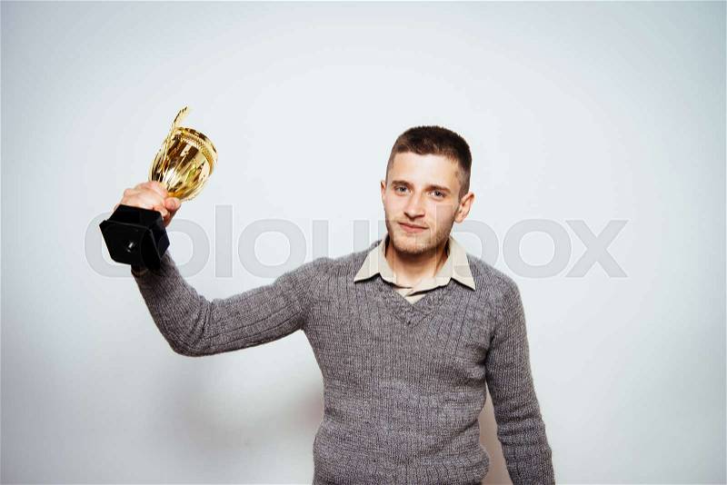 Man with a golden cup, stock photo