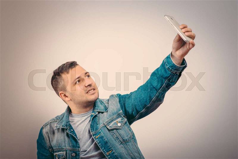 Man makes selfie, stock photo