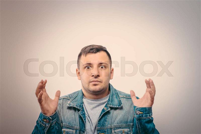 Man throws up his hands, stock photo