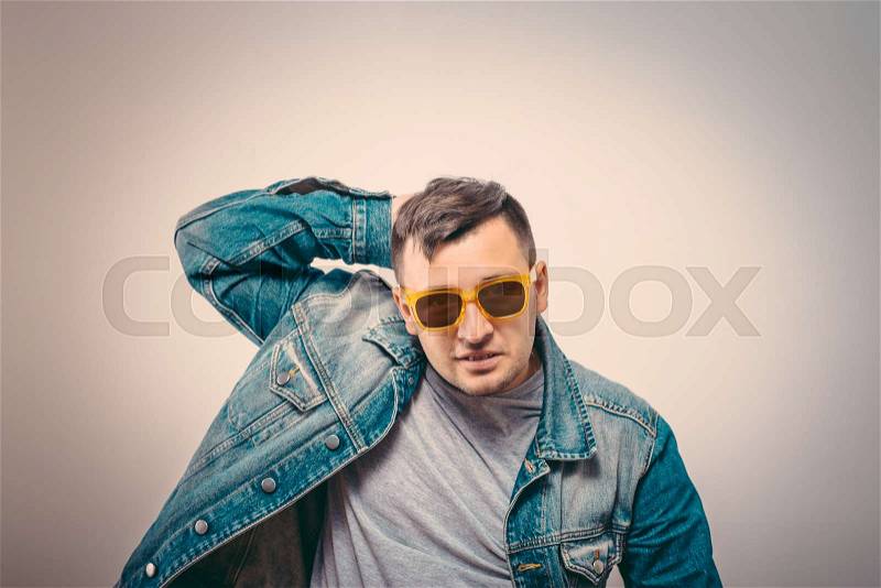 Man with glasses holding his head with his hands. Stress, neurosis, disorder , stock photo