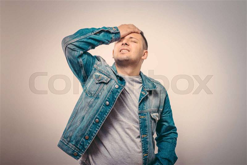 Headache in men, stock photo
