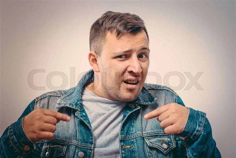 Male hand forefinger pointing to himself on the chest. Gesture. who am i, stock photo
