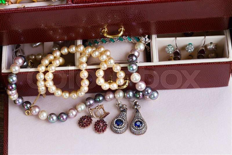 Vintage Jewellery in open treasure box on table close up, stock photo