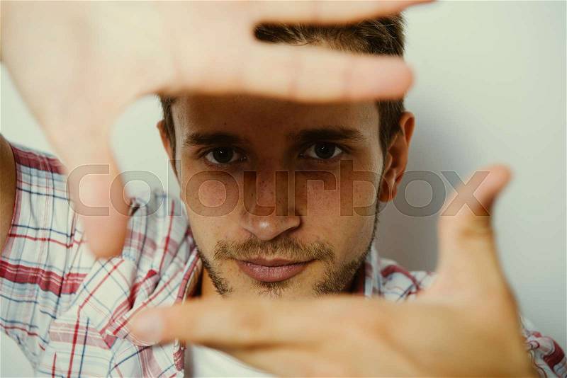 Man making a hand frame, stock photo
