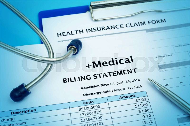 Healthcare cost concept with medical bill and health insurance claim form, stock photo