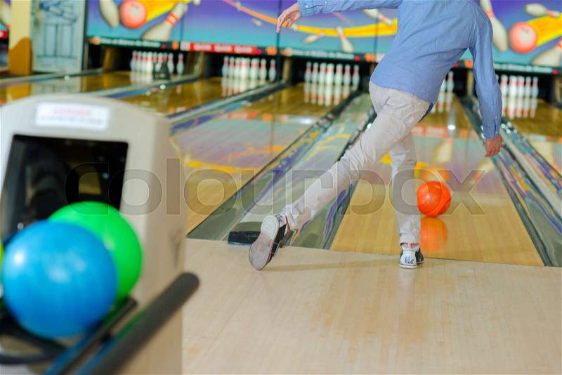 Man ten pin bowling, stock photo