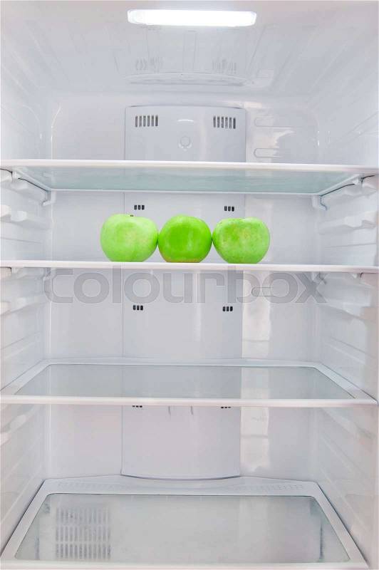 Three apples in the refrigerator, stock photo