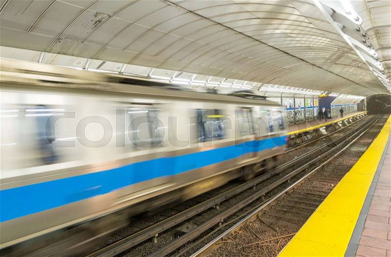 Speeding up train on subway station, stock photo