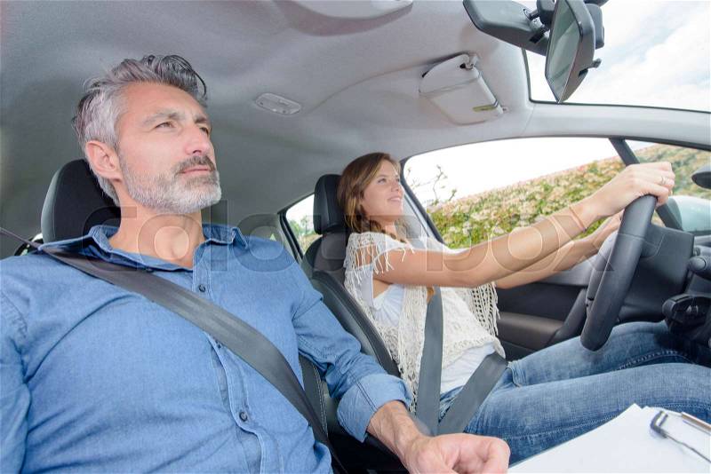 Learner driver having lesson with instructor, stock photo