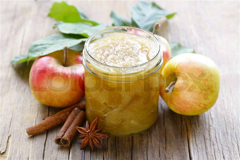 Homemade apple jam confiture with cinnamon and brown sugar, stock photo