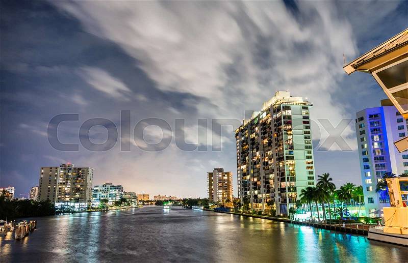 Miami buildings at night with river reflections, stock photo