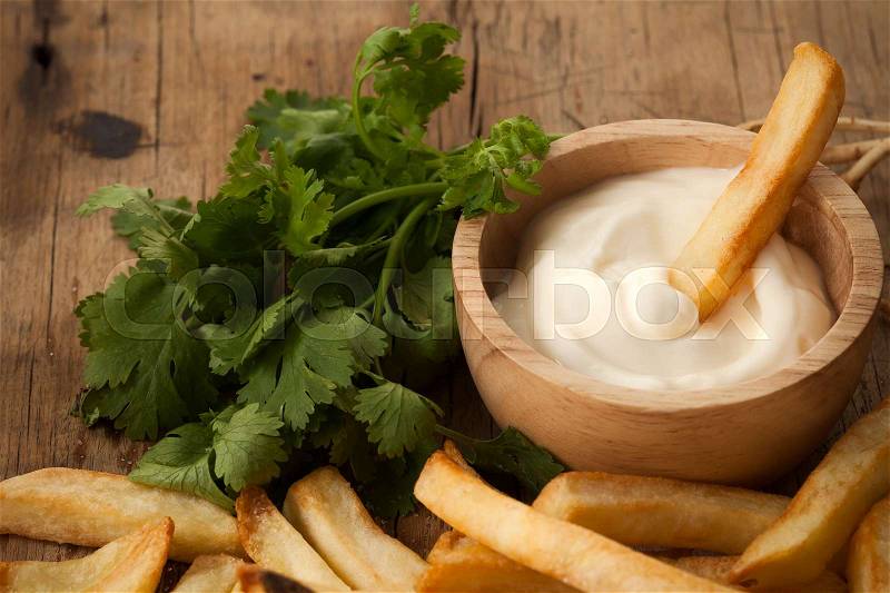 Fries french sour cream herb still life close up rustic salt junk fastfood wood background, stock photo