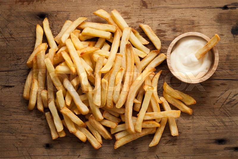 Fries french sour cream still life flat lay rustic salt junk fastfood wood background, stock photo