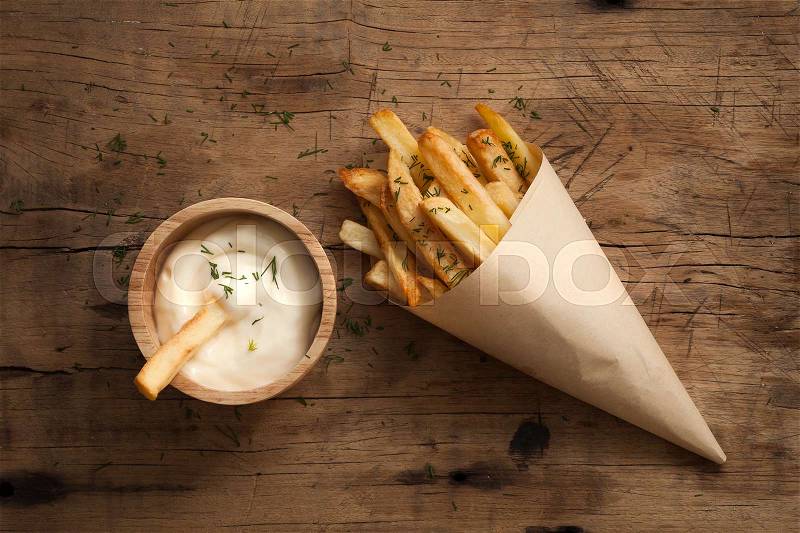 Fries french sour cream still life flat lay rustic salt junk fastfood wood background, stock photo